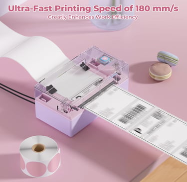 Purple thermal label printer for shipping with fast 180mm/s speed next to macarons and pink sticker roll.