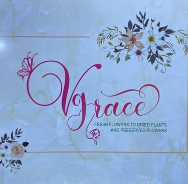 VGrace floral shop sign with marble background, offering fresh to preserved flowers.