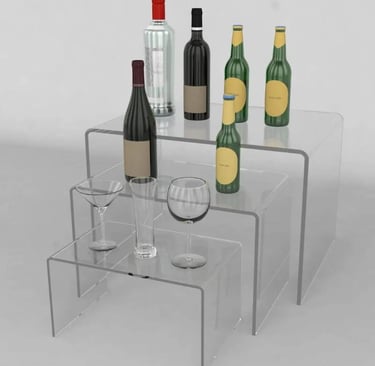 Acrylic risers elegantly presenting wines and glasses, perfect for showcasing and tastings.