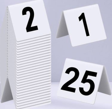 White Acrylic Table Tent with a number 1- 2- 25 with black font, with multiple stacks on 2