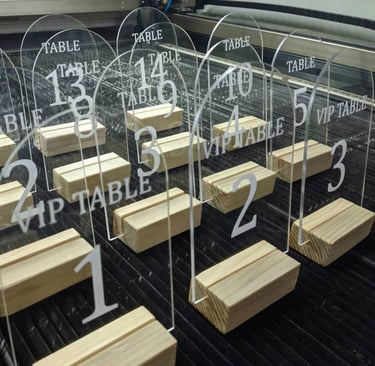 Array of clear Acrylic Table Numbers with bold black script for tables 1 through 5 and VIP precision