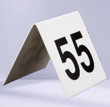 White Acrylic Table Tent with a number 55