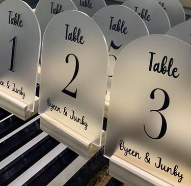 Array of clear Acrylic Table Numbers with bold black script for tables 1 to 5 and VIP precision cut