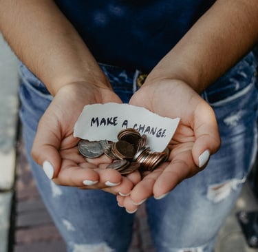 Woman holding a sign that says "make a change."