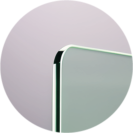 a round mirror with a white frame and a black and white background