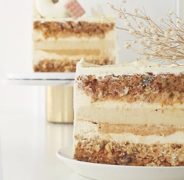 a cake with a white frosting and a flower