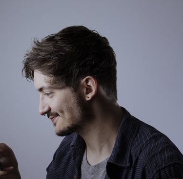 a man in a shirt and a cell phone