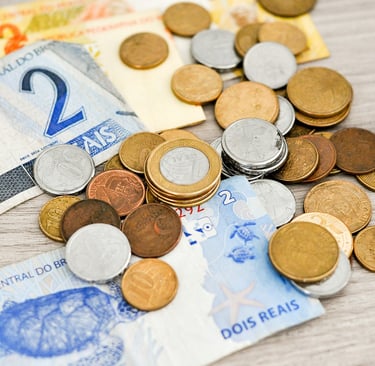 a bunch of cash and coins on a table