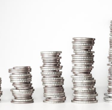 a stack of coins sitting on top of a pile of coins