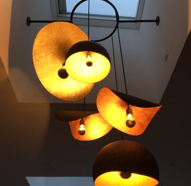 a couple of lamps hanging from a ceiling