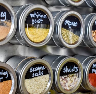 before and after small kitchen spice organization using magnetic spice jars and vertical spice racks