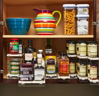 vertical spice rack pull-out drawer in small kitchen cabinet for apartment organization