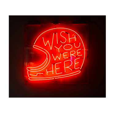 Neon Sign of motorcycle helmet saying Wish You Were Here to represent Motorcycle Riding