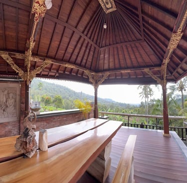 Interior of Joglo house with exposed antique teak beams creating a warm and elegant architectural space