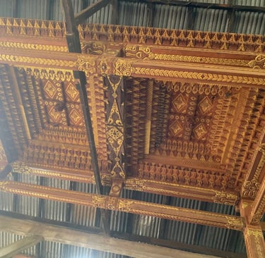 Intricate Joglo roof detail made from antique teak wood highlighting traditional Indonesian craftsmanship techniques