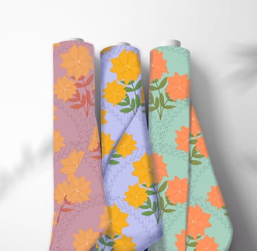 three fabric rolls with flower patterns