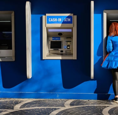 Woman getting cash from ATM