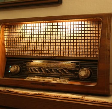 brown and black radio on brown wooden table