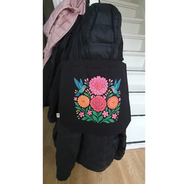 user review floral courage eco tote bag haning on black jacket