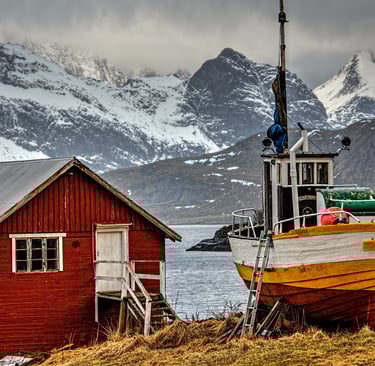 Traditional fishing boat and rorbu cabins in Lofoten
