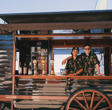Maria and Ulrik smiling in their food truck in Moskenes, Lofoten