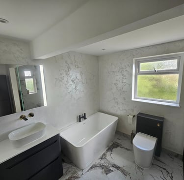 a bathroom with a tub tub and a toilet
