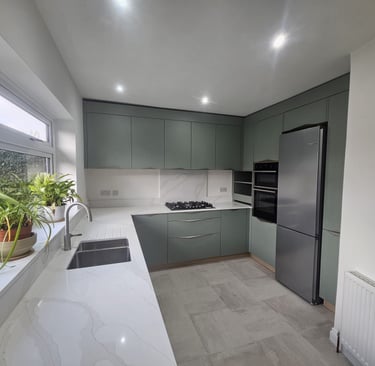 a kitchen with a large window and a potted plant
