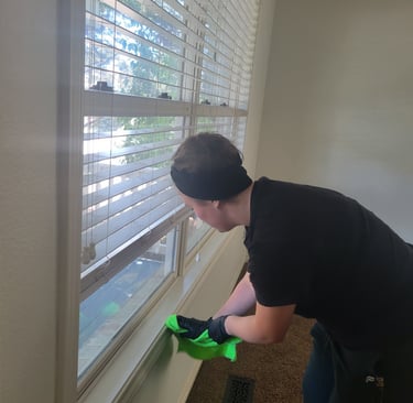 Women cleaning window sill, in move in/ move out King Organic Clean Service
