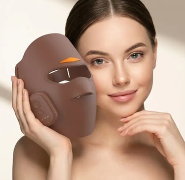 Woman holding a brown LED light therapy mask for facial skincare and anti-aging treatment.