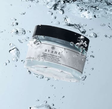 Avant Pro-Intense Hyaluronic Acid Illuminating Day Cream jar submerged in clear water with bubbles.