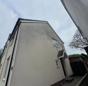 before and after photo of render cleaned by webster exterior in blackpool