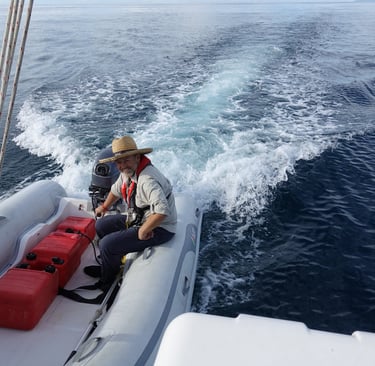 Gary using the tender to push Paje into port