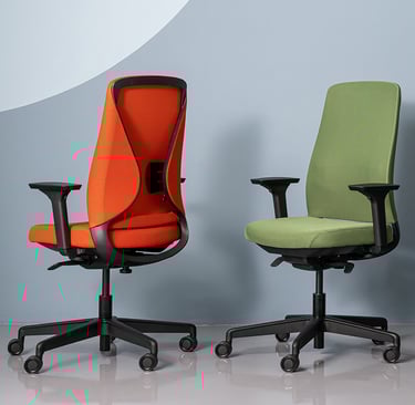 Red and green ergonomic task chairs with mesh backs and adjustable armrests