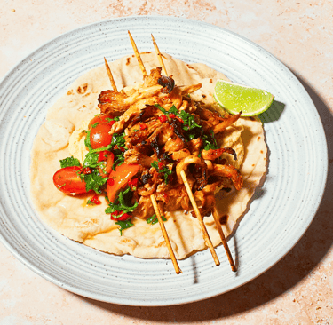 a plate of food with a harrisa oyster mushrooms and salsa