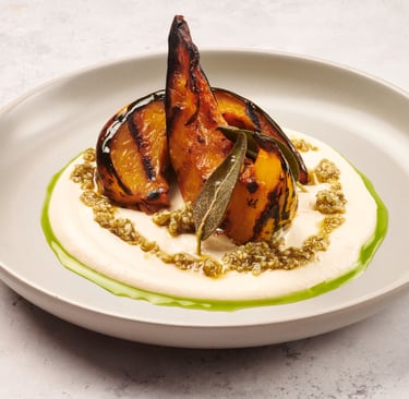 a plate of food with pumpkin and tofu