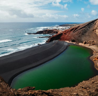 Lanzarote (Spain) a land carved over the Atlantic on fire and lava (photo by JP Files on Unsplash).