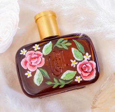 A perfume bottle painted with flowers by New York calligrapher and illustrator Handwritten by Belle.