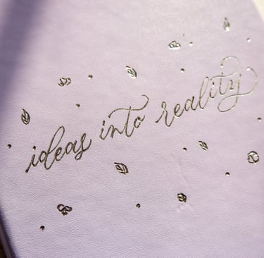 A leather journal customized with hot foiling by NYC calligrapher Handwritten by Belle.