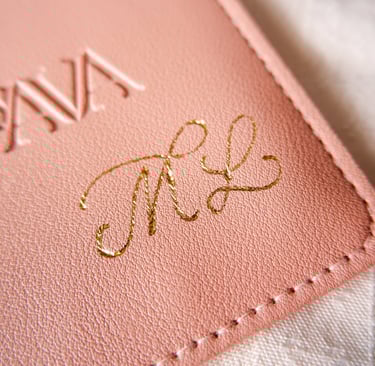A leather pouch customized with gold foiling initials by New York calligrapher Handwritten by Belle.