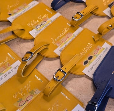 Live personalized bag tags by Handwritten by Belle for a corporate event.