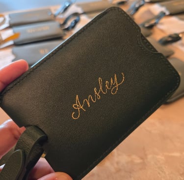 Live hot foiling on luggage tags for a NYC conference by Handwritten by Belle.