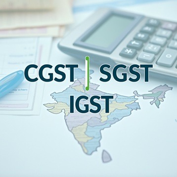 a calculator with map of India in the background on which CGST SGS IGST is written