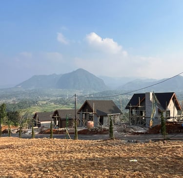 a house being built into a hill with a blue sky