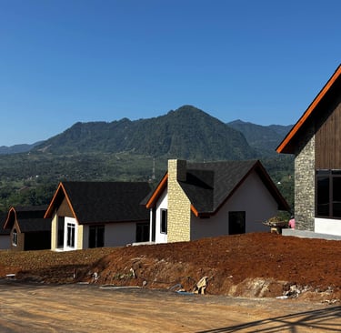 a house with a lot of windows and a mountain in the background