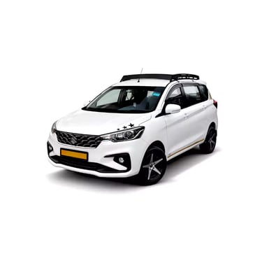 White Maruti Ertiga one way taxi by Saini taxi services with a luggage carrier rack
