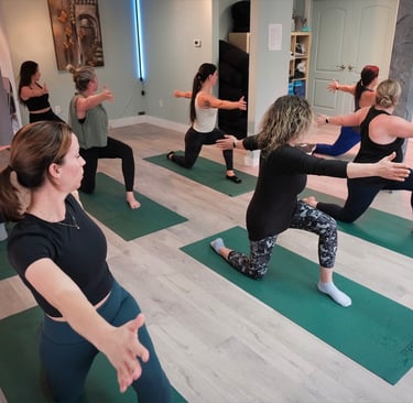 Females doing yoga at a Class at The Iron Cactus Yoga Studio, 2026