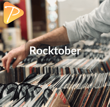 A hand flipping through vinyl records
