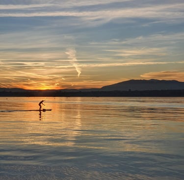 a person is standing on a surfboard in the water
