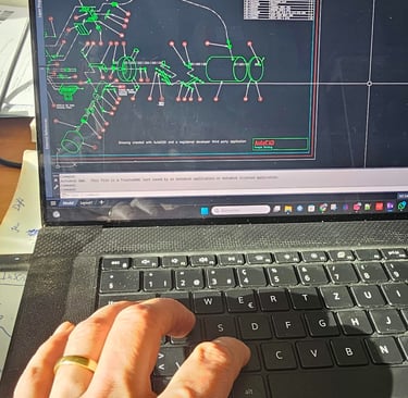 a person's hand on a laptop computer screen