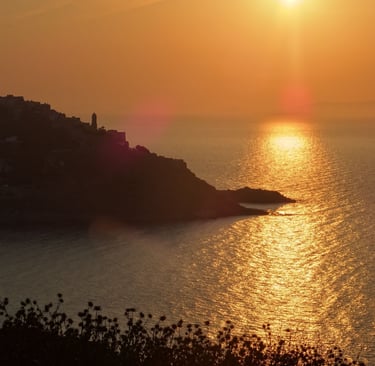 a sunset over a body of water